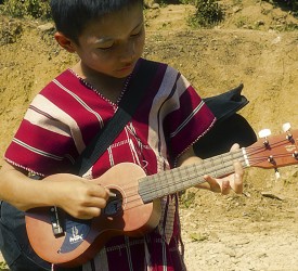 Young boy with his new ukelele.