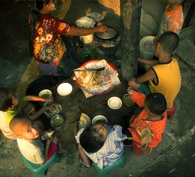 A family gather to enjoy a meal.